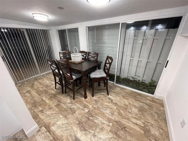 dining room featuring a textured ceiling