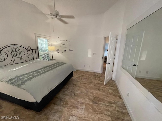 bedroom featuring high vaulted ceiling and ceiling fan