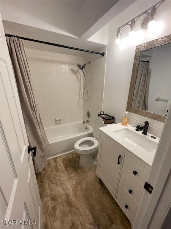 full bathroom featuring shower / tub combo with curtain, vanity, and toilet