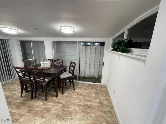 dining room with a textured ceiling