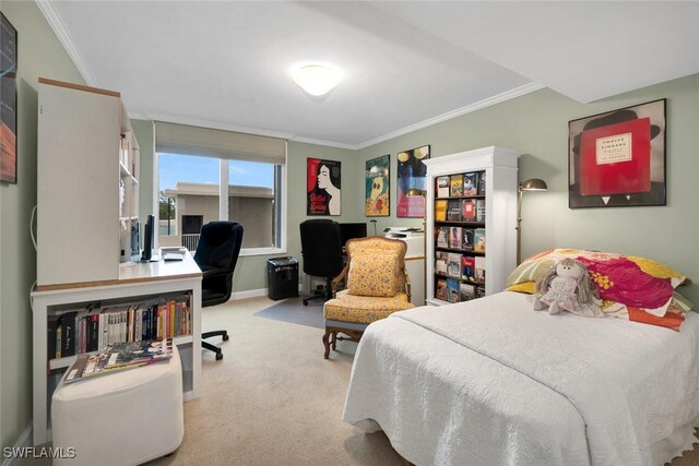 bedroom with light colored carpet and crown molding