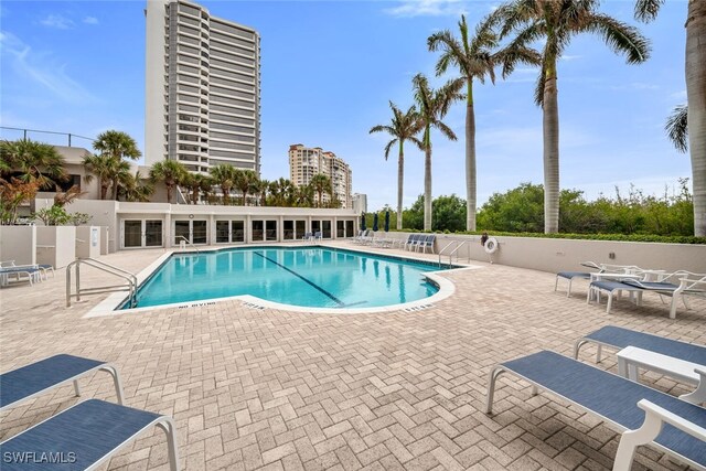 view of swimming pool featuring a patio area