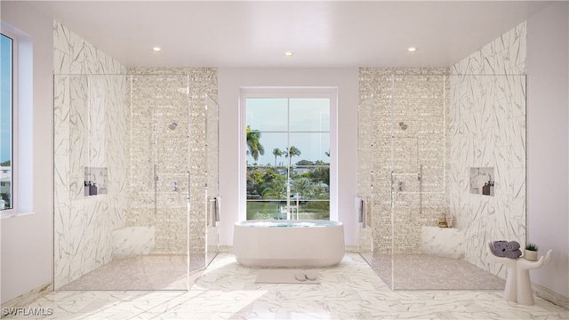 bathroom featuring plenty of natural light and separate shower and tub