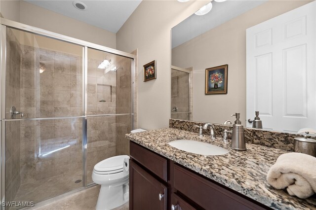 2616 Malaita Ct, Cape Coral, FL 33991 - bathroom with vanity, an enclosed shower, and toilet