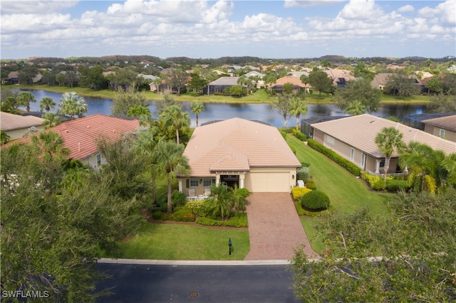 birds eye view of property with a water view