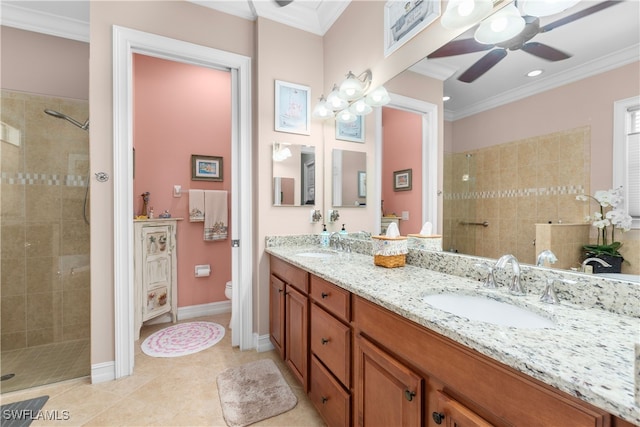 bathroom with toilet, tile patterned flooring, a tile shower, vanity, and crown molding