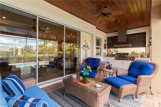 view of patio / terrace featuring area for grilling, an outdoor hangout area, and exterior kitchen