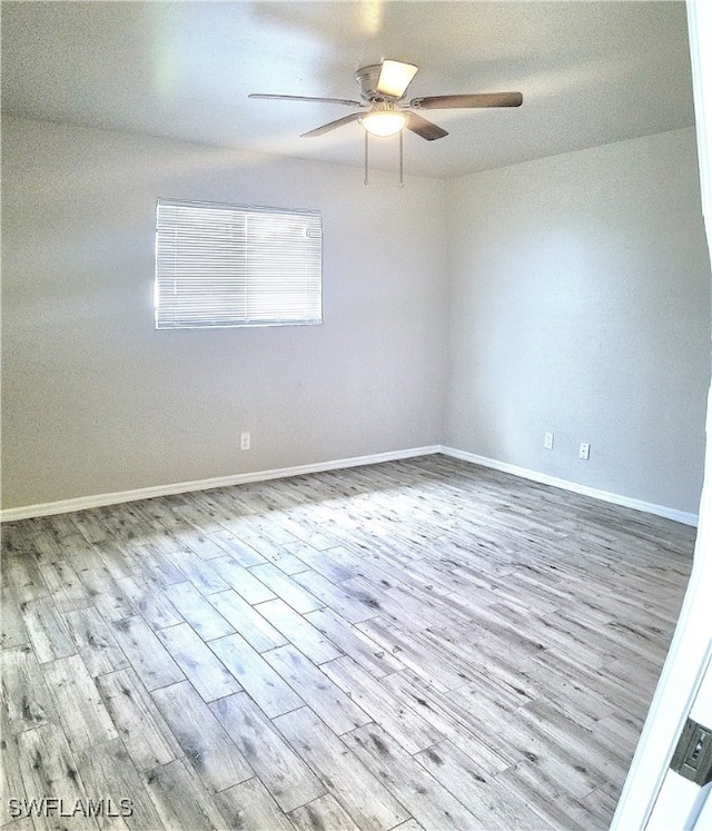 empty room featuring ceiling fan and light wood-type flooring