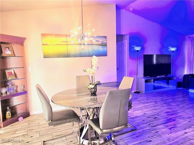 dining space with high vaulted ceiling and wood-type flooring