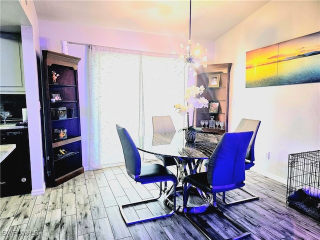 dining area featuring wood-type flooring, lofted ceiling, and a notable chandelier