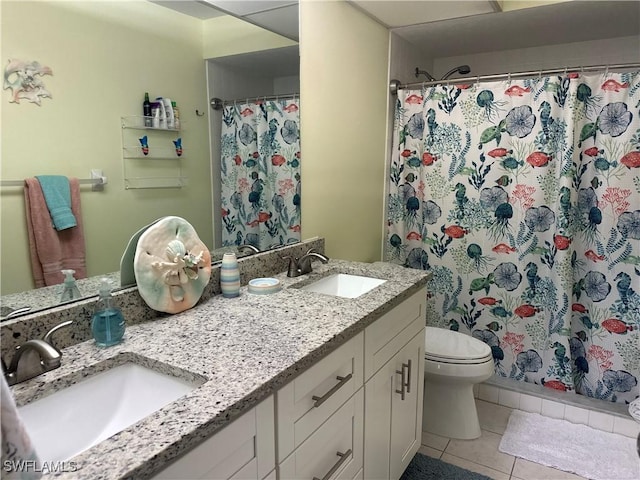 bathroom featuring tile patterned flooring, vanity, a shower with shower curtain, and toilet