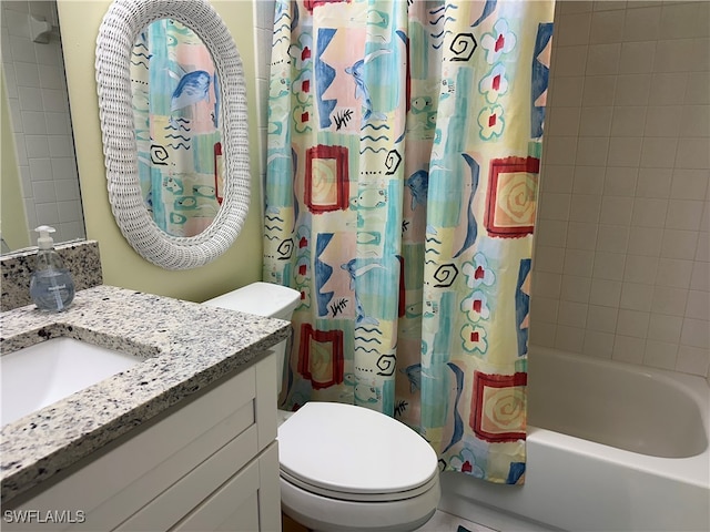 full bathroom with shower / bath combo with shower curtain, vanity, and toilet