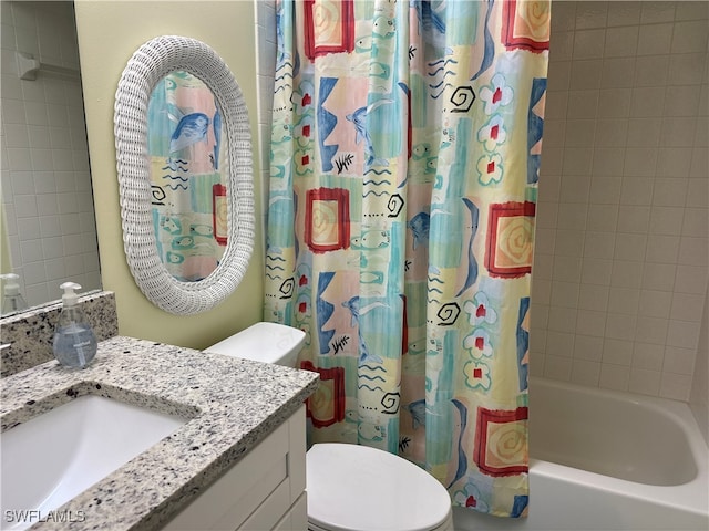 full bathroom featuring shower / bath combo, toilet, and vanity