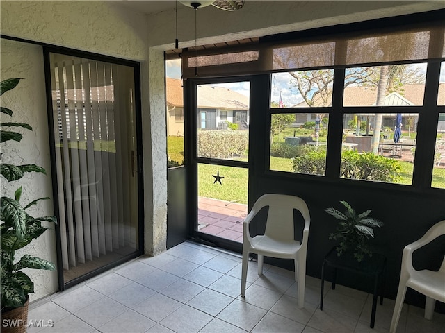 doorway featuring light tile patterned floors