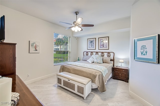 bedroom with light hardwood / wood-style flooring and ceiling fan