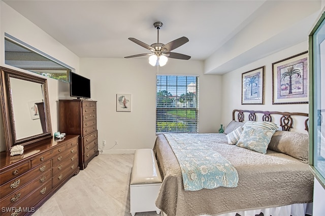 bedroom featuring multiple windows, light hardwood / wood-style flooring, and ceiling fan