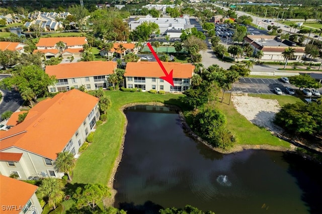 birds eye view of property featuring a water view