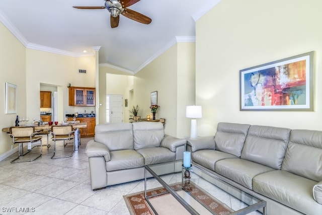 tiled living room featuring crown molding, high vaulted ceiling, and ceiling fan