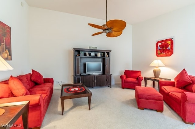 living room with ceiling fan and carpet floors