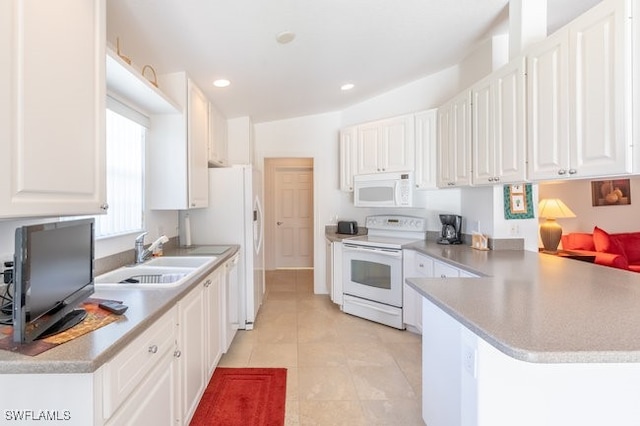 kitchen featuring white appliances, sink, kitchen peninsula, light tile patterned floors, and white cabinetry