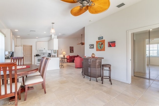 dining area featuring ceiling fan and light tile patterned flooring