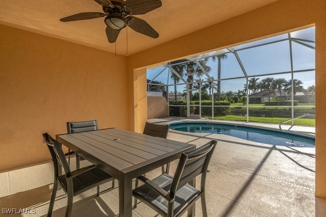 exterior space featuring a patio area, ceiling fan, and a lanai