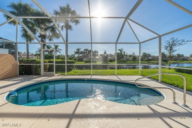 view of swimming pool featuring a lanai, a water view, and a patio