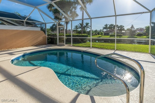 view of pool with a patio area, a lanai, and a water view