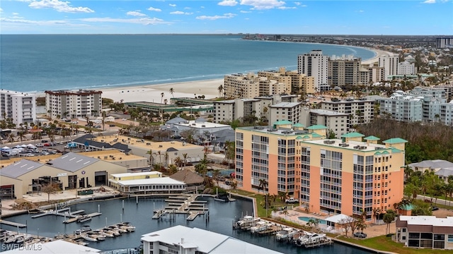 bird's eye view featuring a view of the beach and a water view