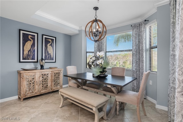 tiled dining space featuring crown molding and an inviting chandelier