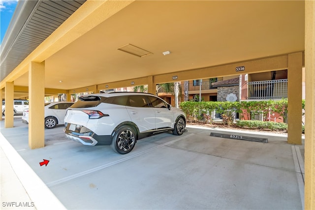 garage featuring a carport