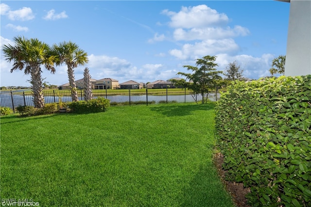 view of yard with a water view