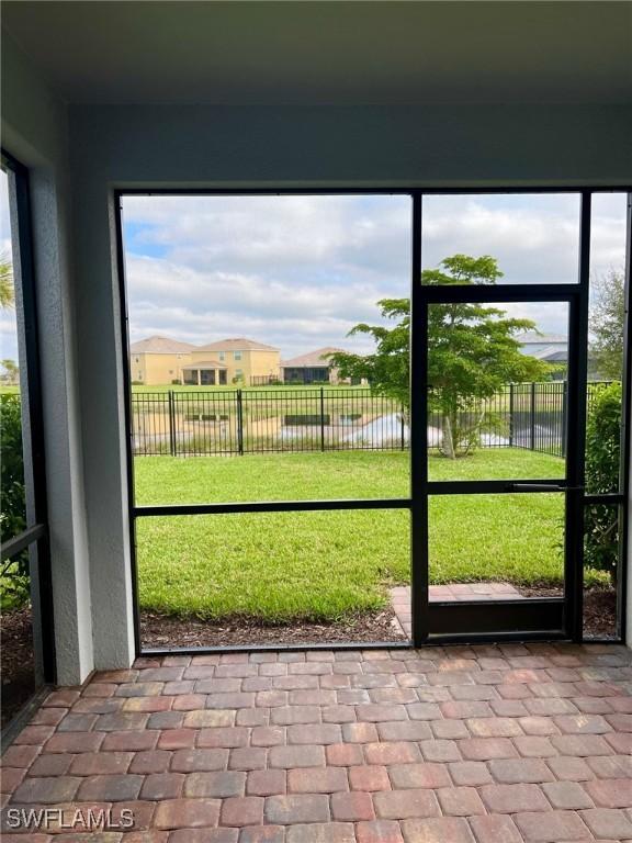 unfurnished sunroom with a water view