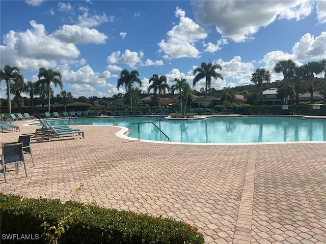 view of swimming pool with a patio area