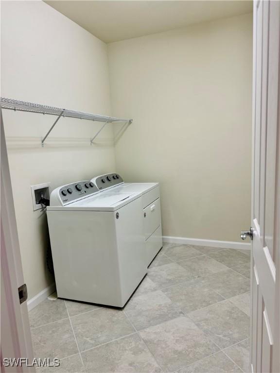 laundry area featuring separate washer and dryer