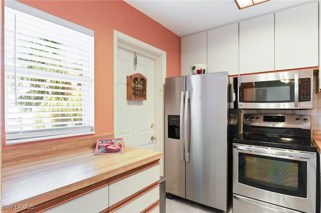 kitchen featuring white cabinetry and stainless steel appliances