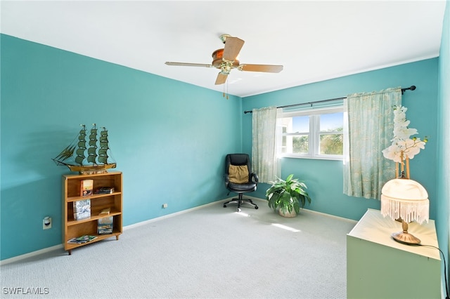 sitting room featuring ceiling fan and carpet flooring