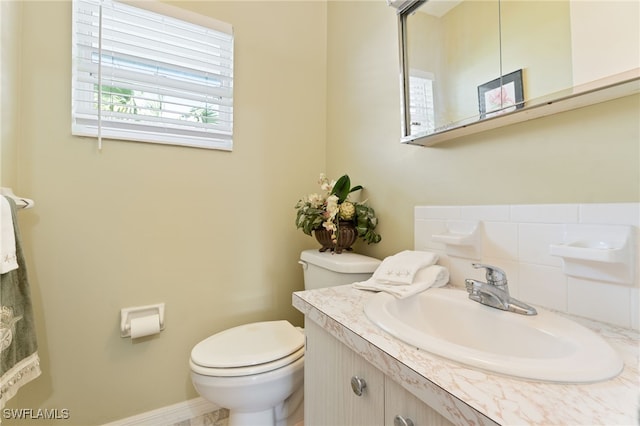 bathroom featuring toilet and vanity