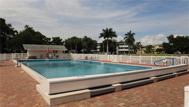 view of swimming pool featuring a patio area