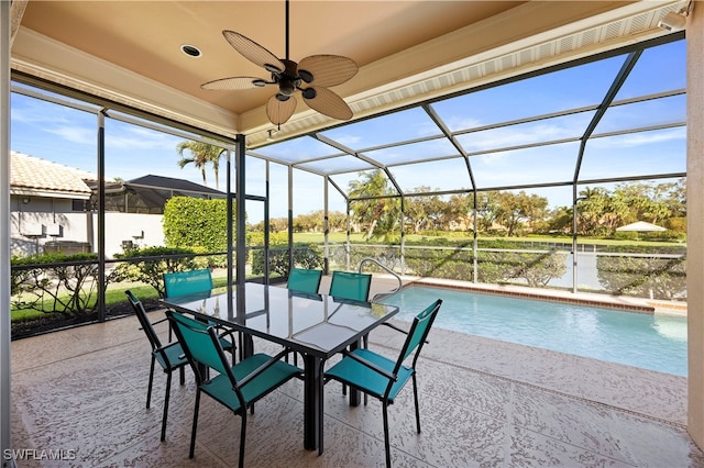 view of swimming pool with a patio area, ceiling fan, and a lanai