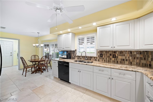 kitchen with dishwasher, white cabinets, sink, tasteful backsplash, and decorative light fixtures