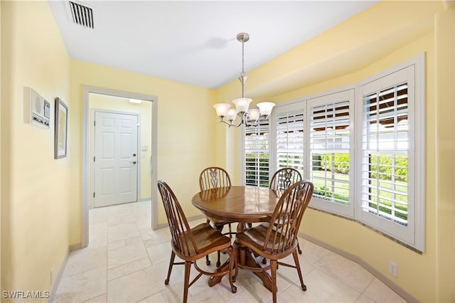 dining room with a notable chandelier