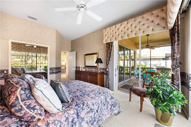 bedroom with ceiling fan, access to exterior, and light carpet