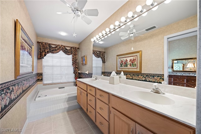 bathroom featuring tile patterned floors, tiled bath, ceiling fan, and vanity