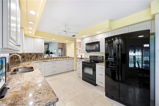 kitchen with white cabinetry, sink, ceiling fan, and black appliances