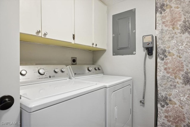 4231 SE 19th Pl Unit 1J, Cape Coral, FL 33904 - laundry room featuring electric panel, washing machine and clothes dryer, and cabinet space