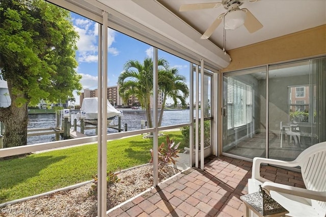 4231 SE 19th Pl Unit 1J, Cape Coral, FL 33904 - sunroom with a water view and a ceiling fan