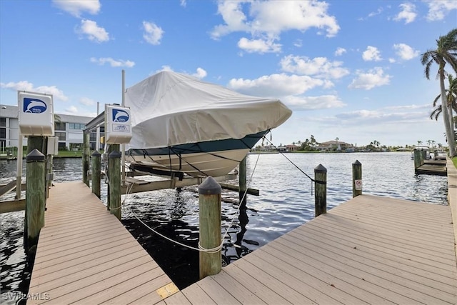 4231 SE 19th Pl Unit 1J, Cape Coral, FL 33904 - dock with boat lift and a water view