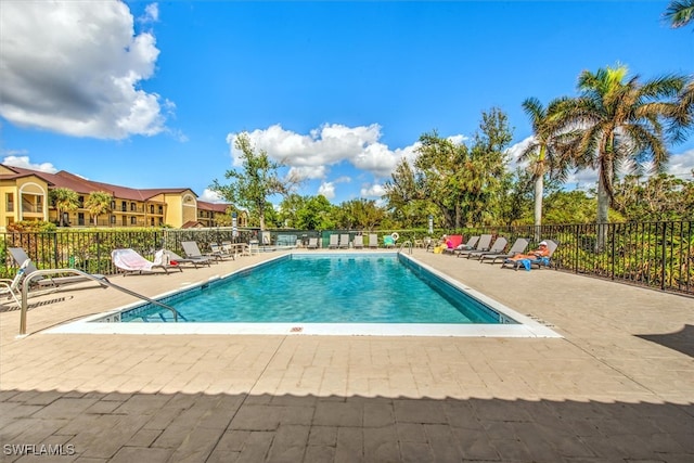 view of swimming pool with a patio area