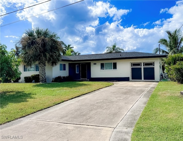 single story home with a front lawn and a garage